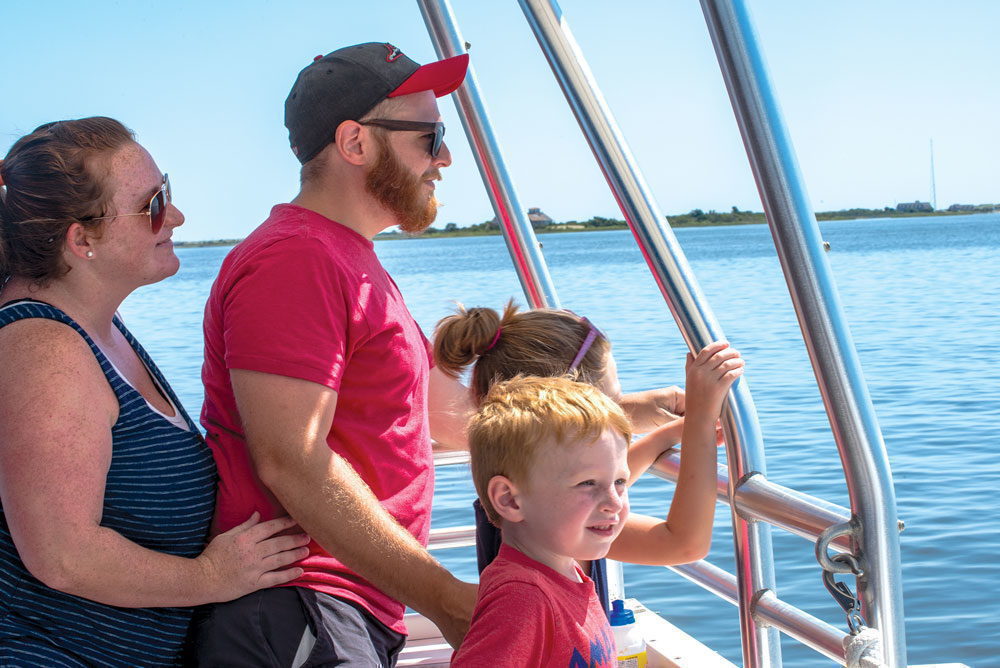 A family of passengers aboard Paradise Dolphin Cruises